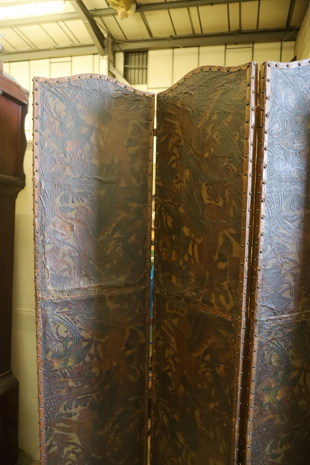 A Dutch leather four fold screen, c.1860, each panel 49cm x 203cm